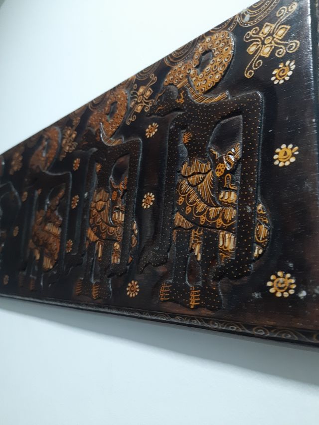 Talla africana madera