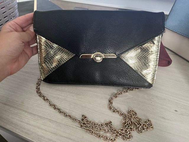 Bolso negro y dorado de Blanco