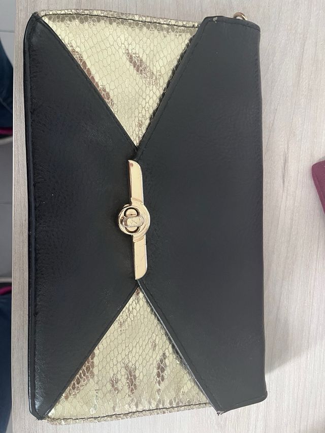 Bolso negro y dorado de Blanco