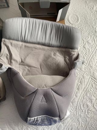 Mochila porteo Ergobaby con cojín reductor
