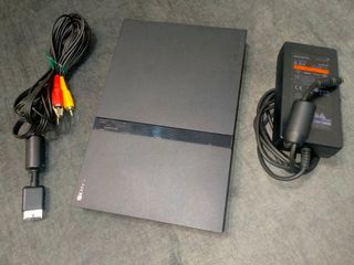 Ps2 slim con pack de 4 juegos