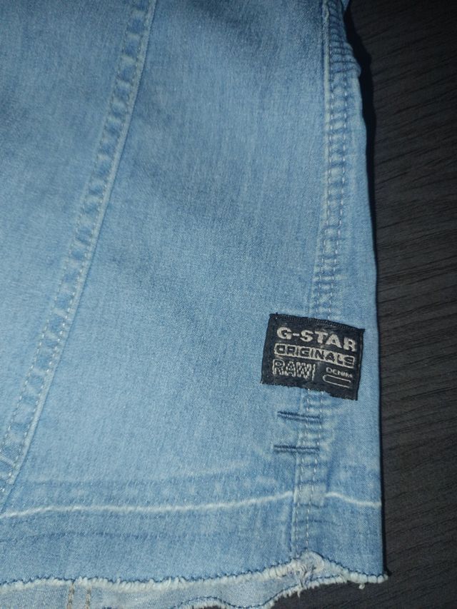 Top vaquero sin mangas y con botones