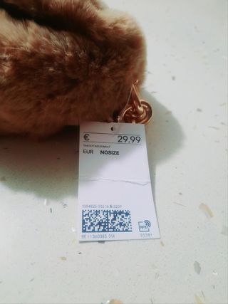 Borsetta in ecopelliccia e catena oro H&M
