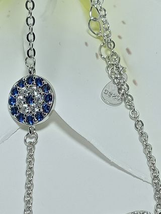Preciosa pulsera de doble fetiche plata.