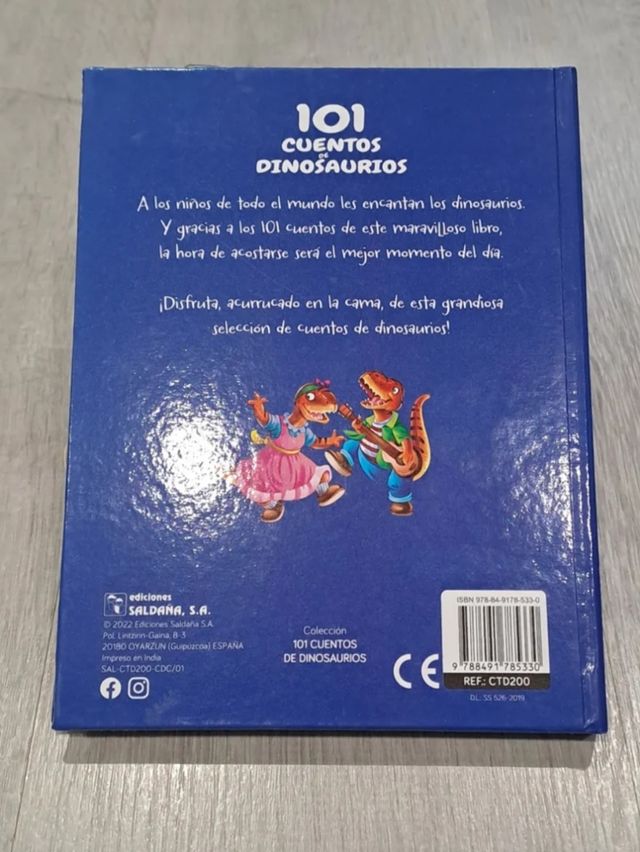 Dinosaurio con mando + libro + figuras