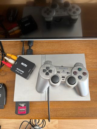 PlayStation2 Slim Silver + juego + volante + cam