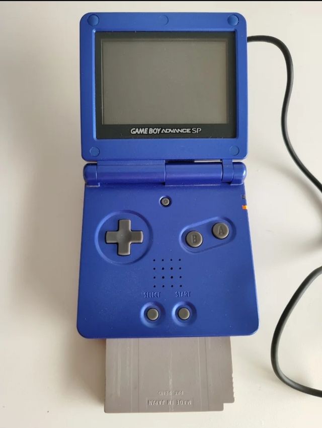Game boy SP + dos manuales