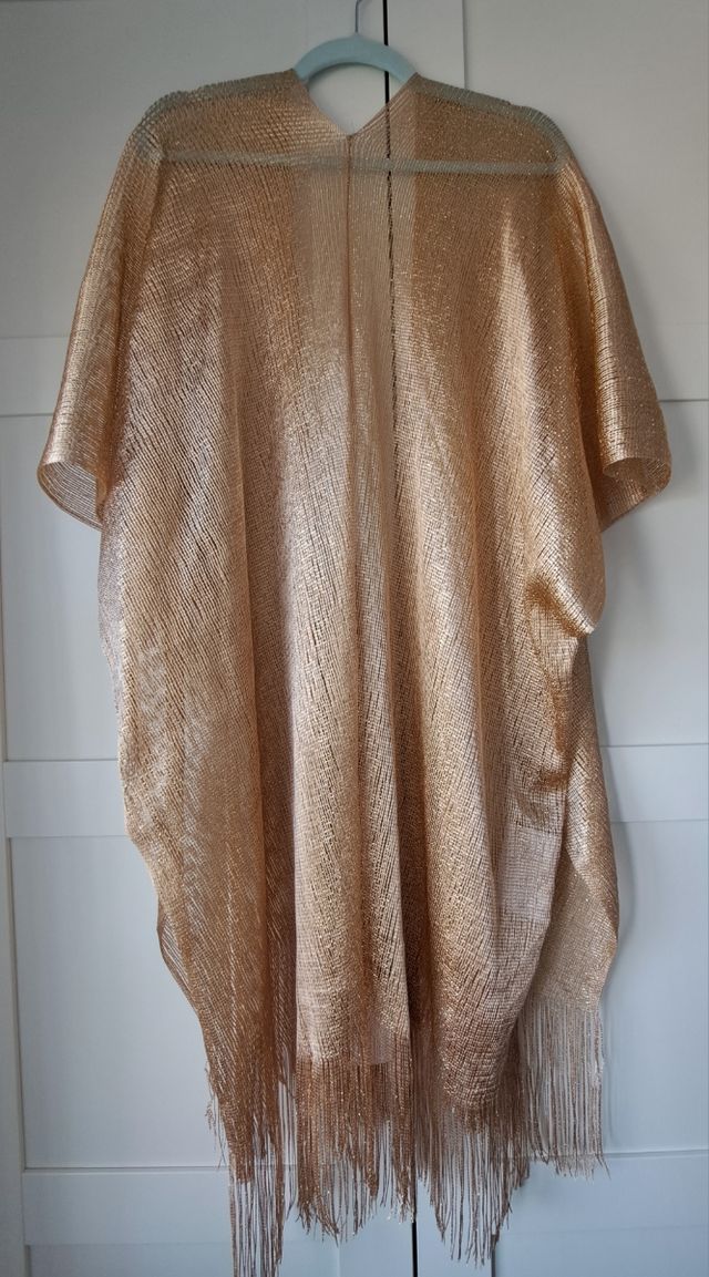 Chaqueta dorada flecos