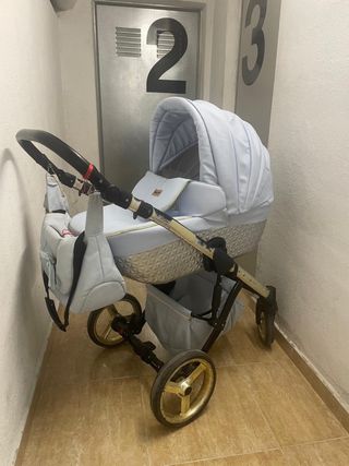 Carro bebe azul y dorado