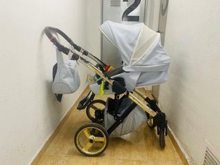 Carro bebe azul y dorado