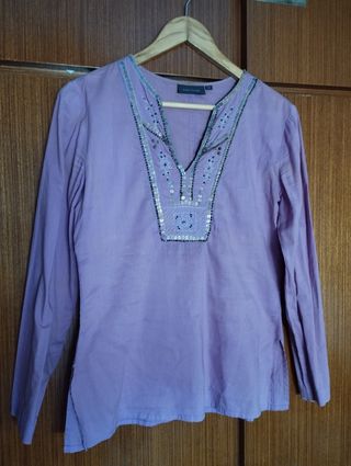 Blusa con lentejuelas. Kiabi Woman.