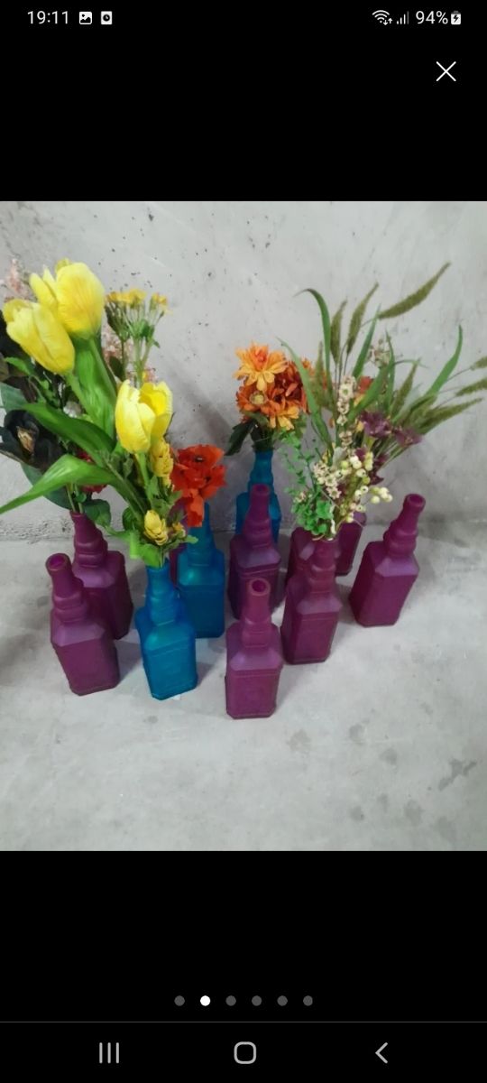 Botellas cristal con flores