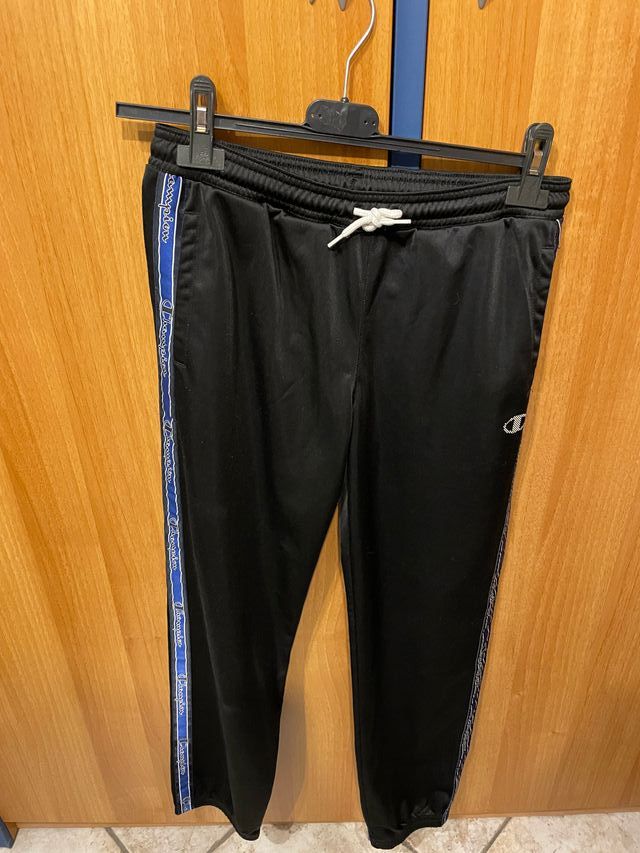 tuta Champion Nera e bordi Blu