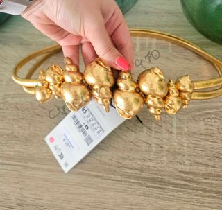 Cinturón metálico caracolas dorado zara