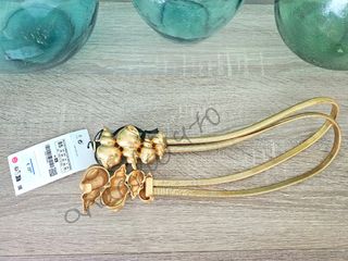 Cinturón metálico caracolas dorado zara