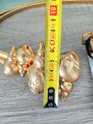 Cinturón metálico caracolas dorado zara