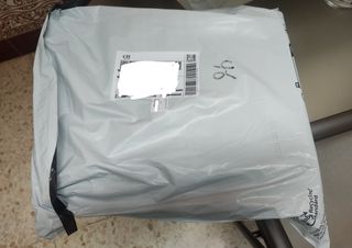 Armario montable con cortinas embalado, sin abrir