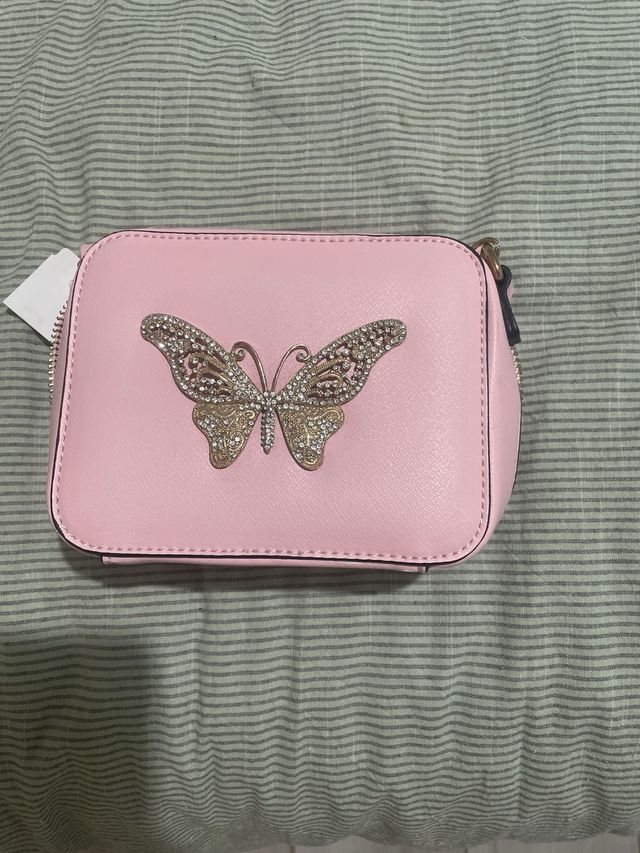 Borsetta rosa a cubetto da ragazzina