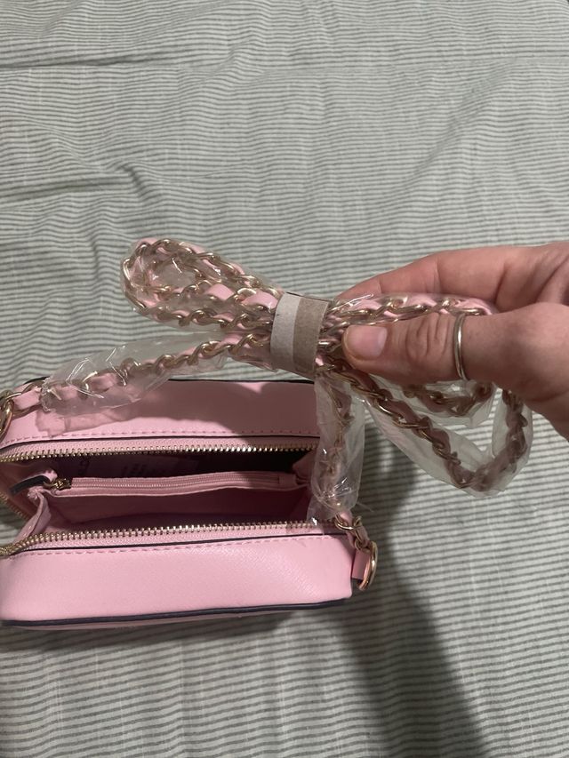 Borsetta rosa a cubetto da ragazzina