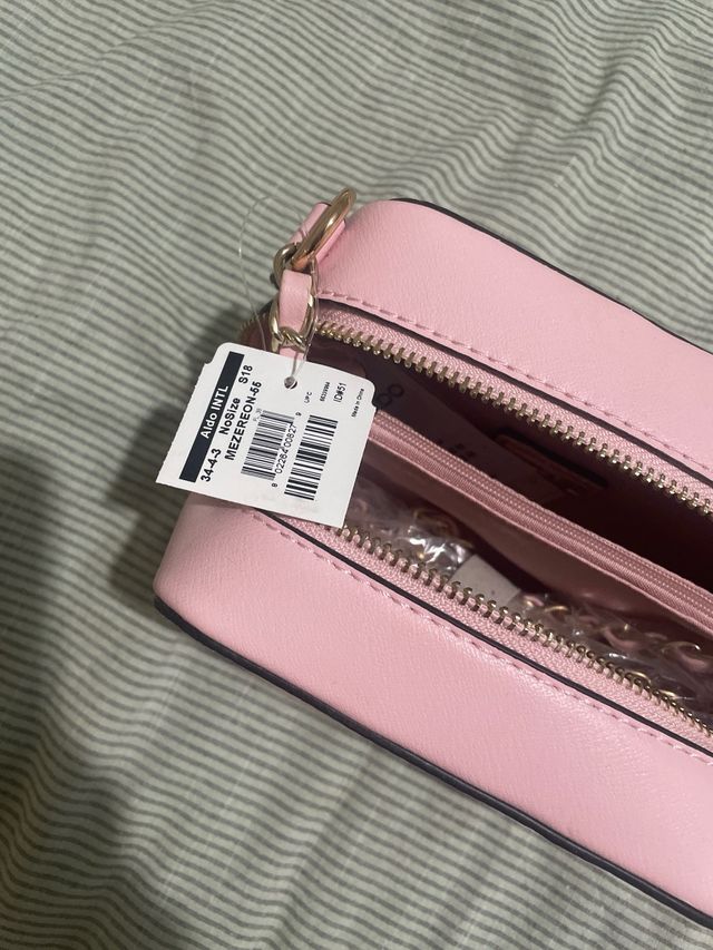 Borsetta rosa a cubetto da ragazzina