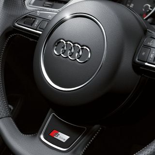 Emblema adhesivo S Line gris para volante de Audi