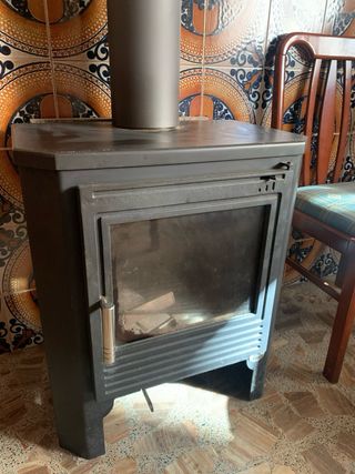Estufa de leña y tubos (unos 5 mts)