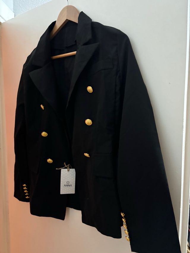 Chaqueta botoned dorados