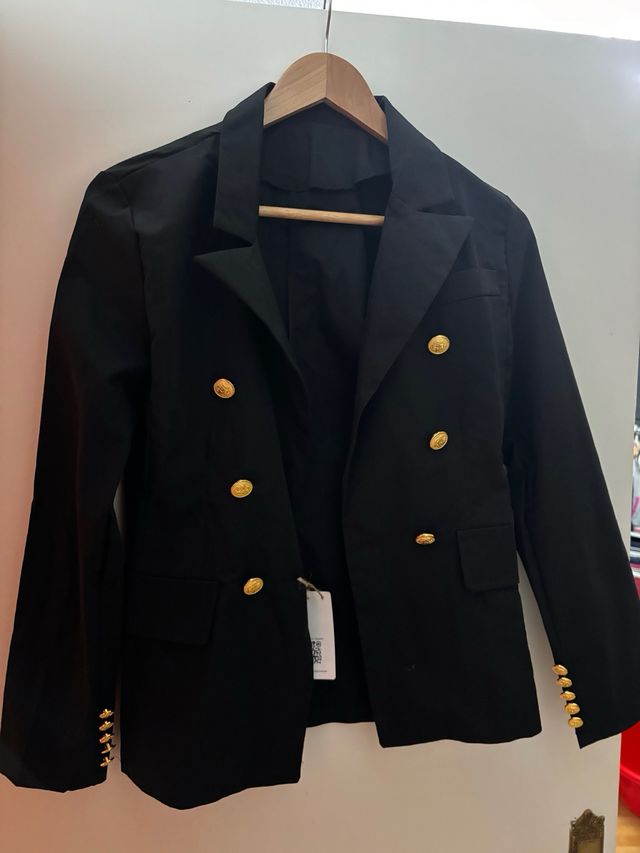 Chaqueta botoned dorados