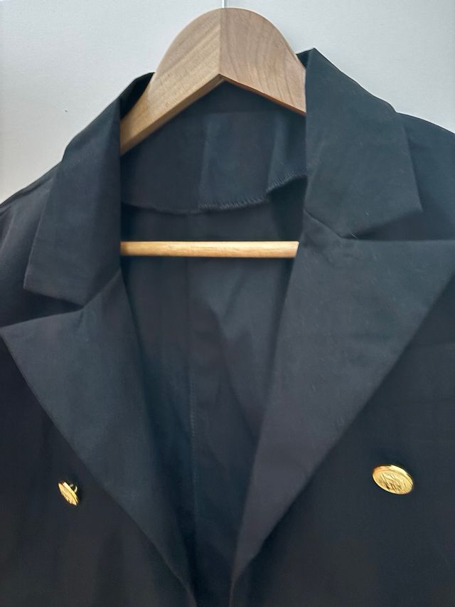 Chaqueta botoned dorados