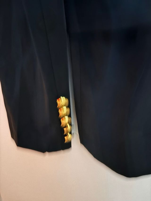 Chaqueta botoned dorados