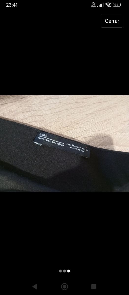 Top negro cruzado con flecos