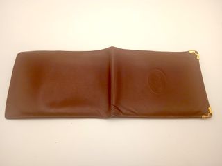 Portafoglio Must de Cartier in pelle marrone