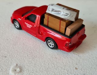 A todo gas ford f150 hotwheels supra mini gt ixo