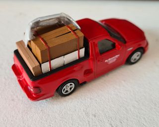 A todo gas ford f150 hotwheels supra mini gt ixo