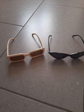 Occhiali da sole, color crema e color nero