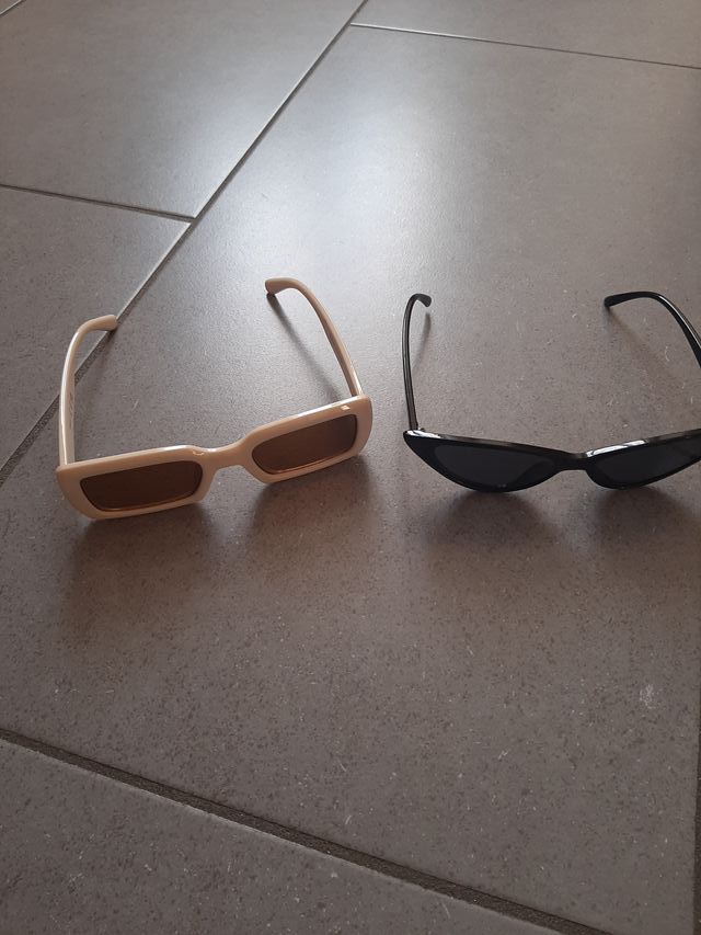 Occhiali da sole, color crema e color nero