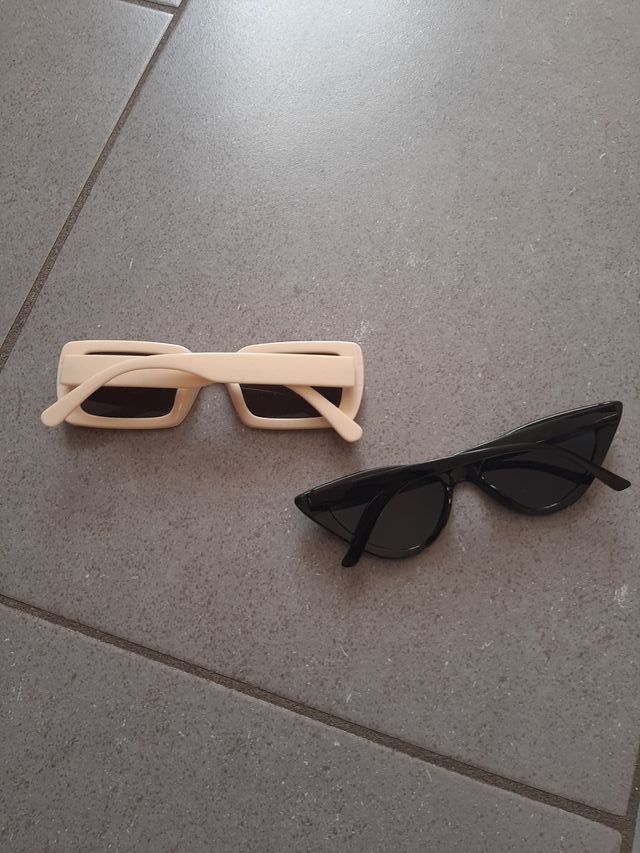 Occhiali da sole, color crema e color nero