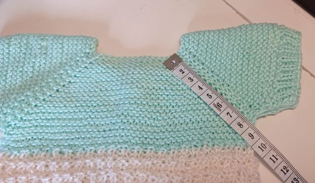 Pelele recién nacido con patucos