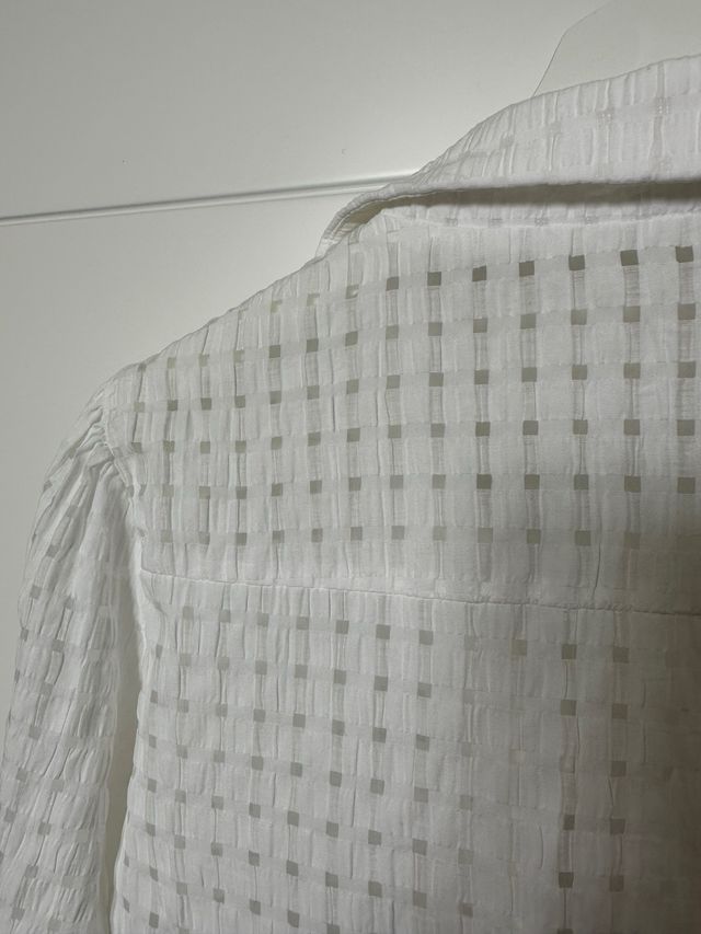 Blusa a cuadros semitransparentes