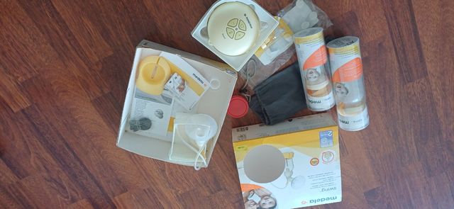 Sacaleches Medela 2 biberones y varios recambios