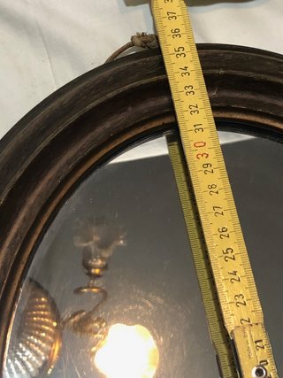 Specchio ovale con cornice in legno