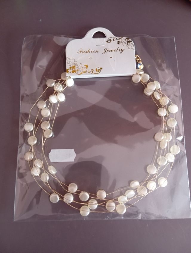 Collar perlas al aire