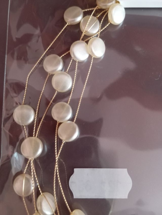 Collar perlas al aire