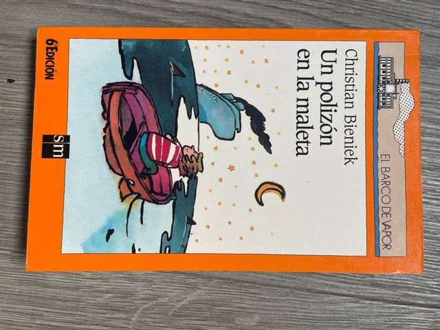 Un polizón en la maleta. Barco de vapor naranja.