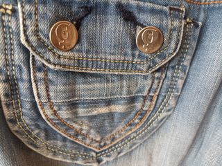 Vaqueros vintage con el símbolo de la mujer