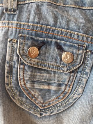 Vaqueros vintage con el símbolo de la mujer