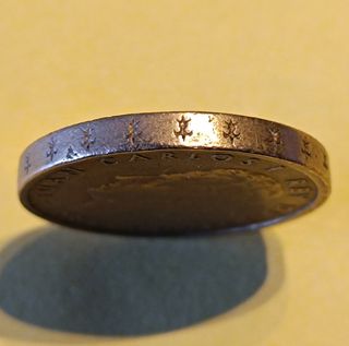 100 pesetas de 1986, lis abajo