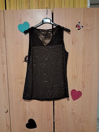 Blusa negra brillante