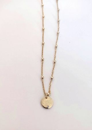 Colgante letra s bano de oro 