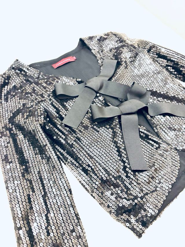 Chaqueta lentejuelas con lazada ideal para Navidad
